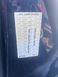 233010